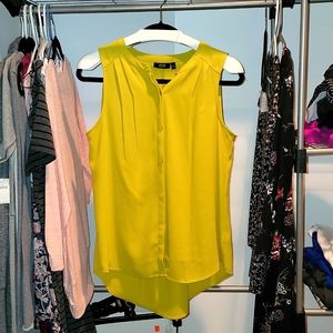 Sleeveless, lightweight high-low Blouse.